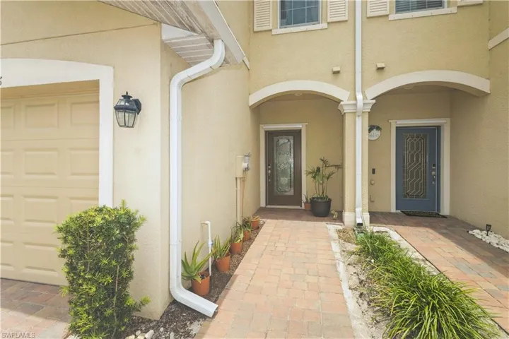 Entrance to property featuring a garage