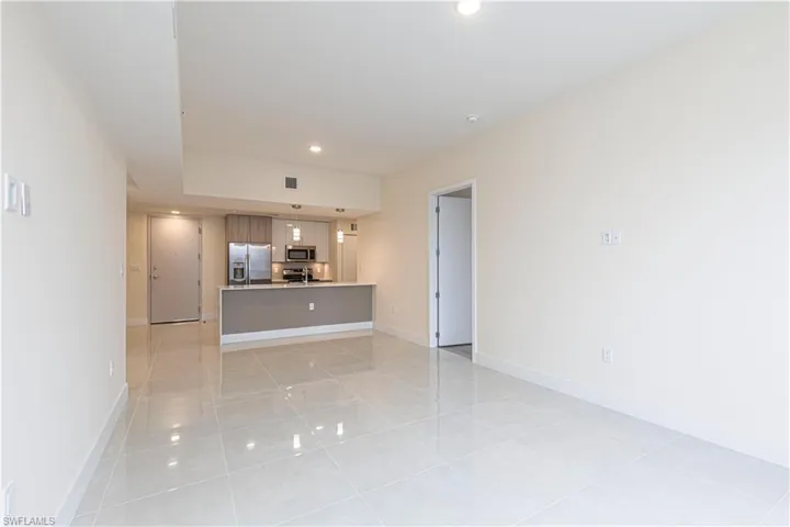 Unfurnished living room with light tile patterned floors
