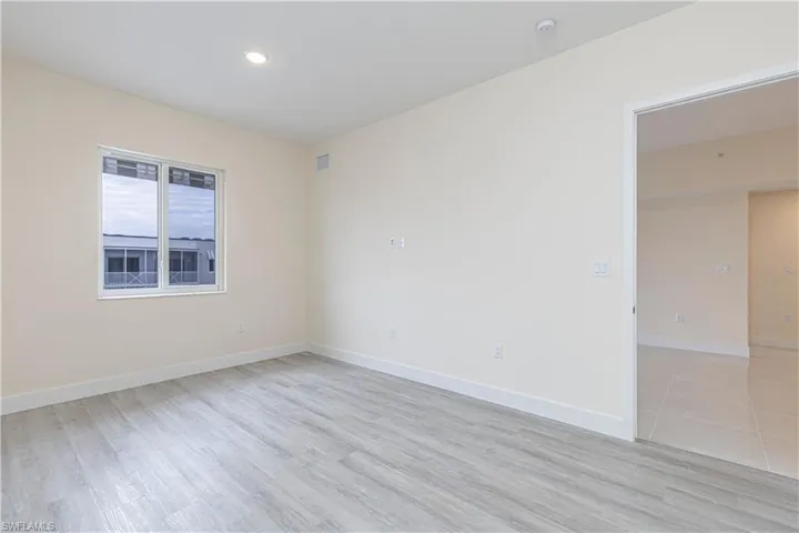 Unfurnished room with light wood-type flooring