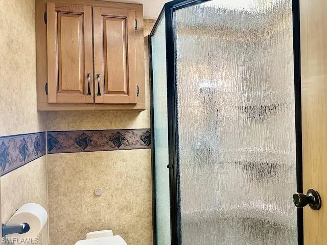 Bathroom featuring an enclosed shower