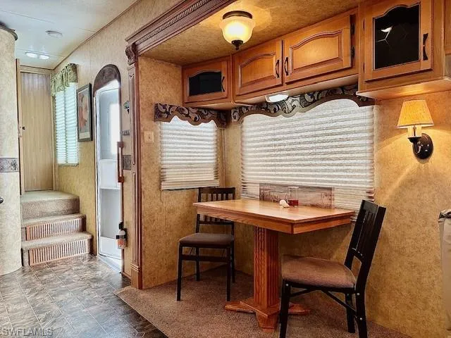 Dining space with dark tile floors