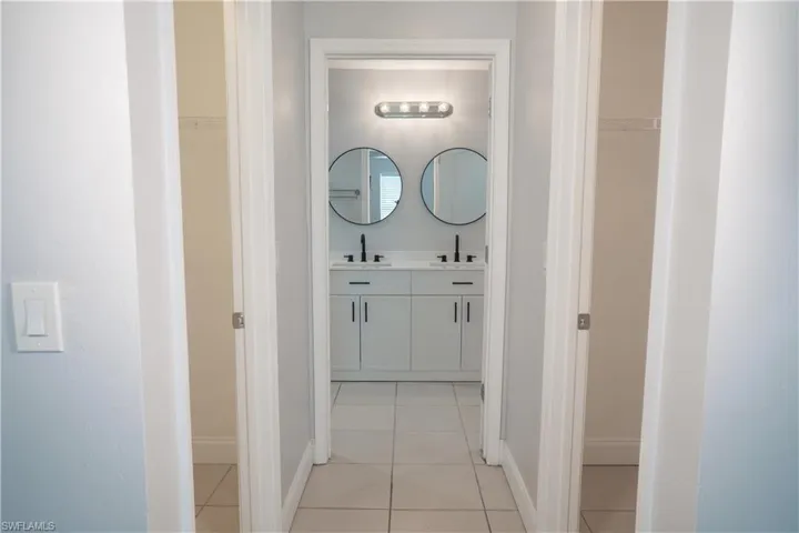 Master suite featuring ceiling fan, window with view of the back yard, double closets.