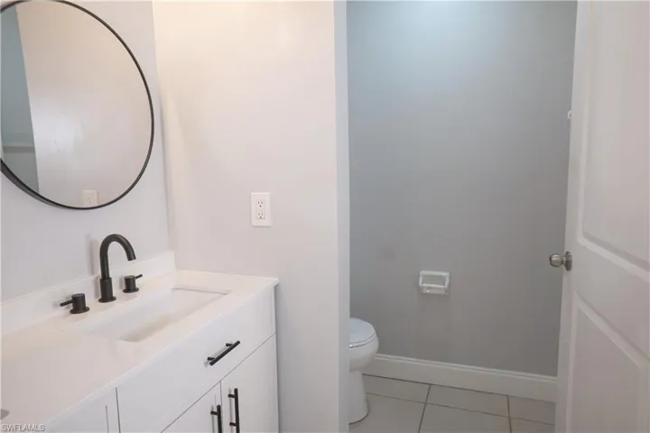 Master bath with tub & shower, double-sink vanity.