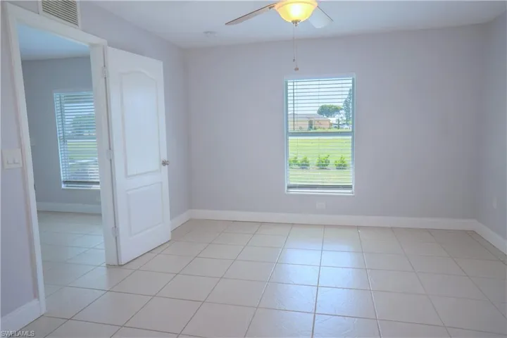#1 Walk in closet featuring light tile patterned floors