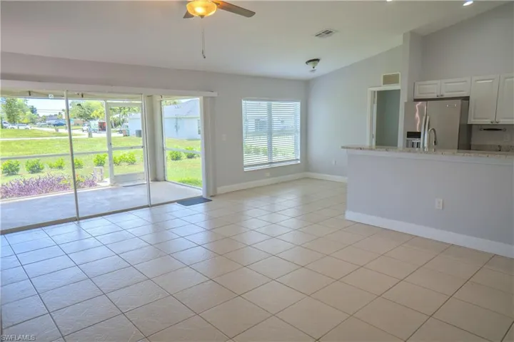 Bedroom #2 with bifold closet doors and ceiling fan.