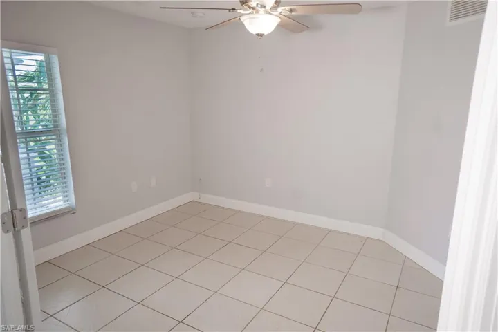 2 car garage featuring electric panel and an automatic garage door opener