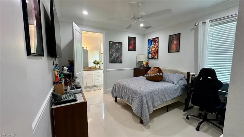 Bedroom with crown molding, light tile patterned floors, a ceiling fan, and recessed lighting