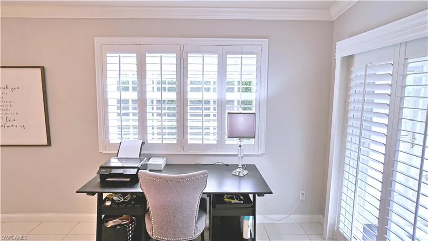 Tiled office space with crown molding