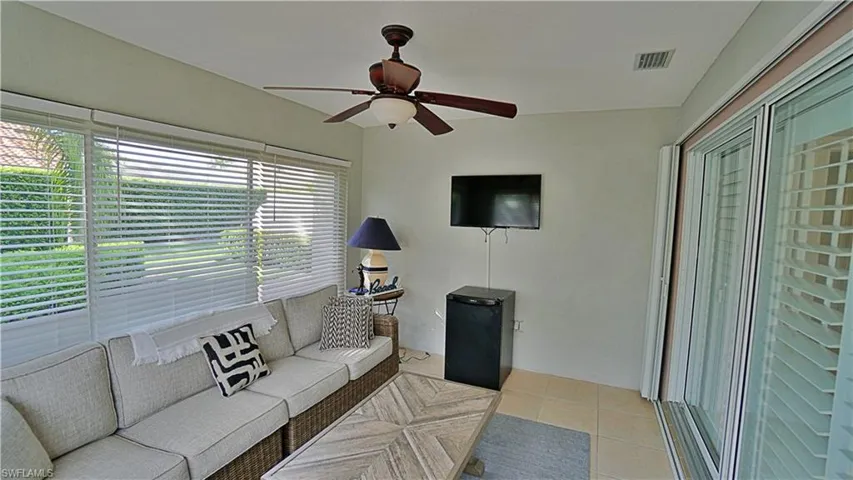 FLORIDA room with ceiling fan and light tile patterned flooring