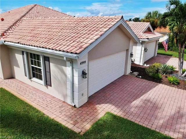 Back of house featuring a garage
