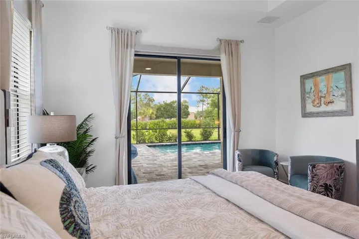 Bedroom featuring access to exterior and multiple windows