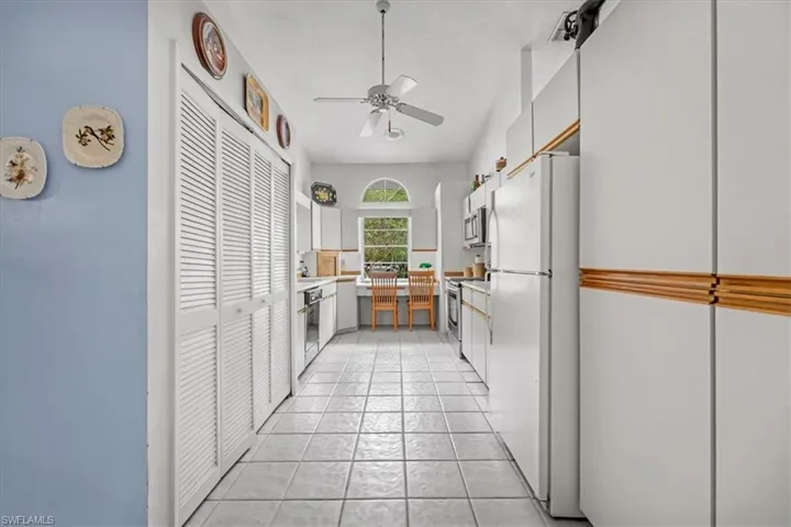 Kitchen with built in desk and laundry closet