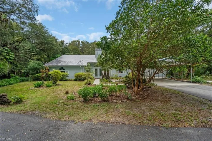 Front view of home and circle driveway