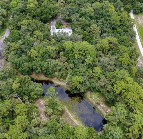 Aerial view of home and pond