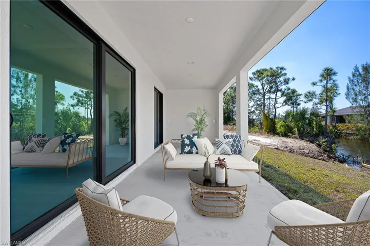 View of patio with outdoor lounge area and a water view