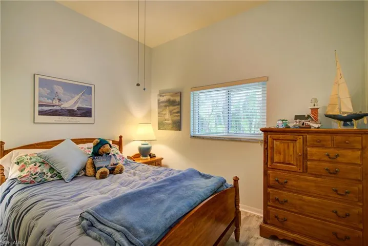 Bedroom with baseboards and light wood-type flooring
