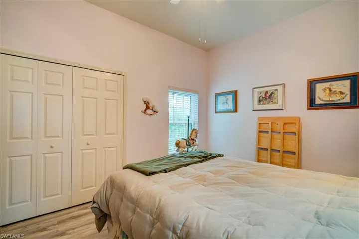 Bedroom featuring a closet and wood finished floors