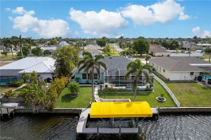Drone / aerial view featuring a water view and a residential view
