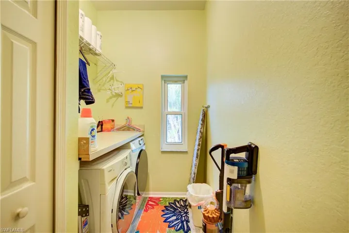 Washroom with washer / dryer, baseboards, and laundry area