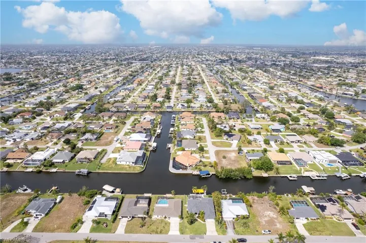 Aerial view featuring a residential view and a water view