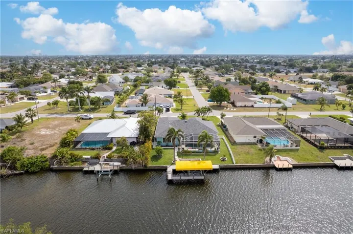 Bird's eye view featuring a water view and a residential view