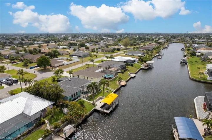 Bird's eye view with a water view and a residential view