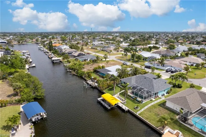 Aerial view featuring a residential view and a water view