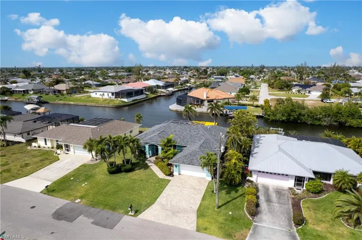 Drone / aerial view with a residential view and a water view