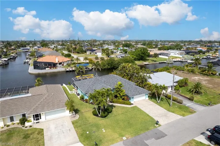 Aerial view featuring a water view and a residential view