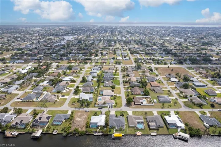 Drone / aerial view featuring a residential view and a water view