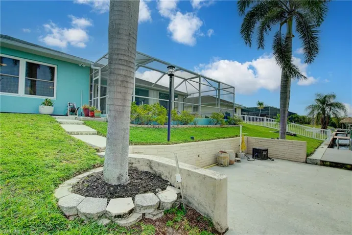 View of patio / terrace featuring a lanai and fence