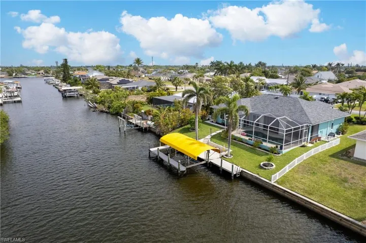 Drone / aerial view with a residential view and a water view