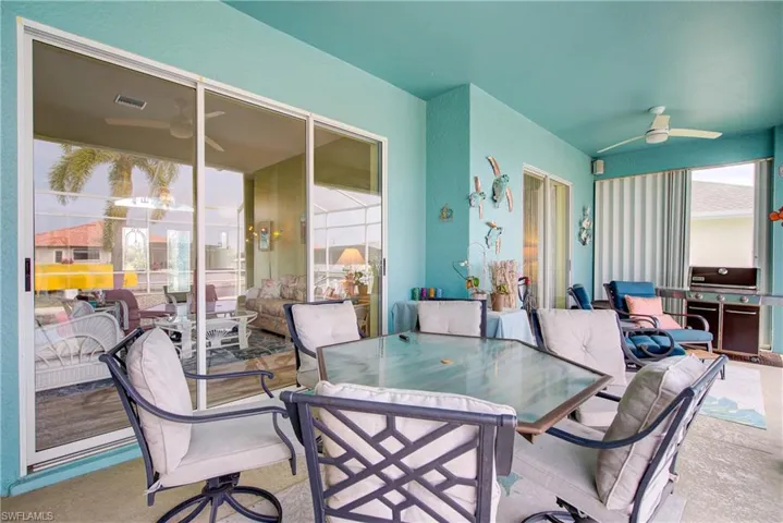 View of patio / terrace featuring a ceiling fan, outdoor dining area, and visible vents