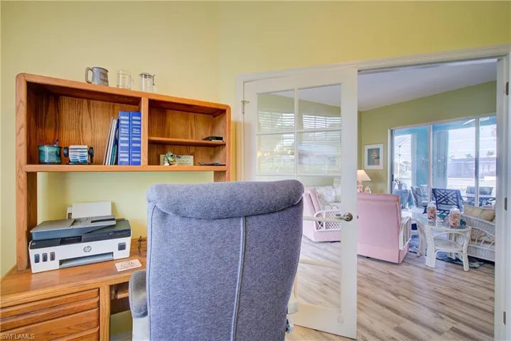Home office with wood finished floors
