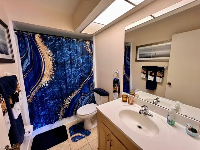 Bathroom featuring vanity and light tile patterned flooring