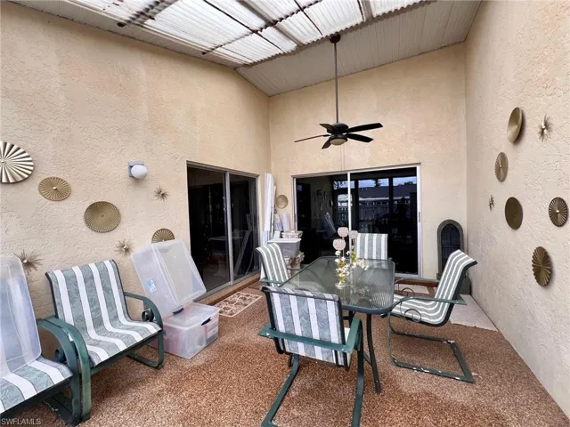 View of patio featuring a ceiling fan and outdoor dining space