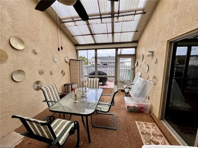 Sunroom with outdoor dining area