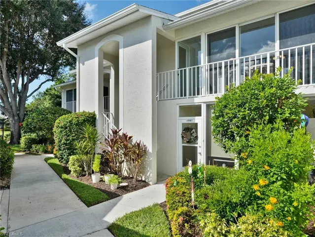 Doorway to property with stucco siding