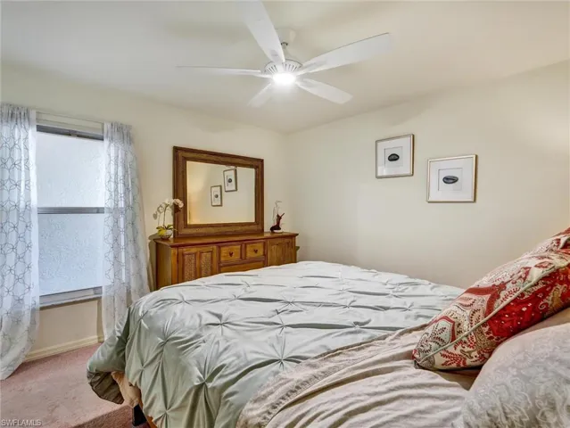 Bedroom featuring carpet and ceiling fan