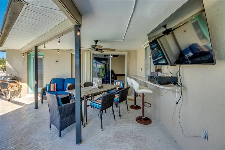 View of patio / terrace with outdoor dining space and a ceiling fan