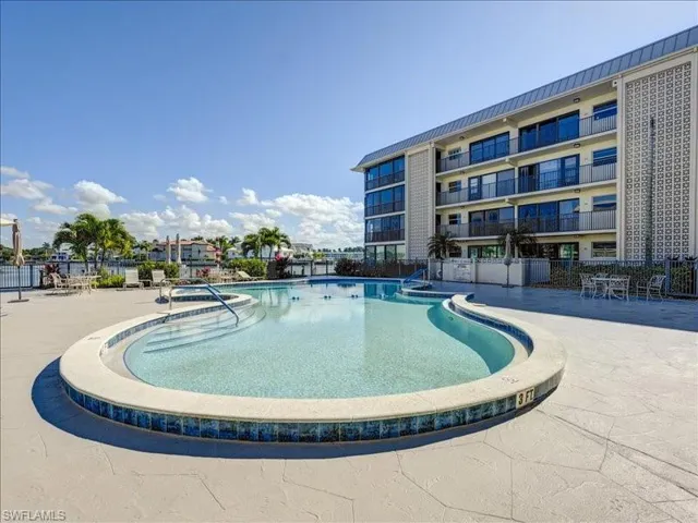 Community pool with a patio area