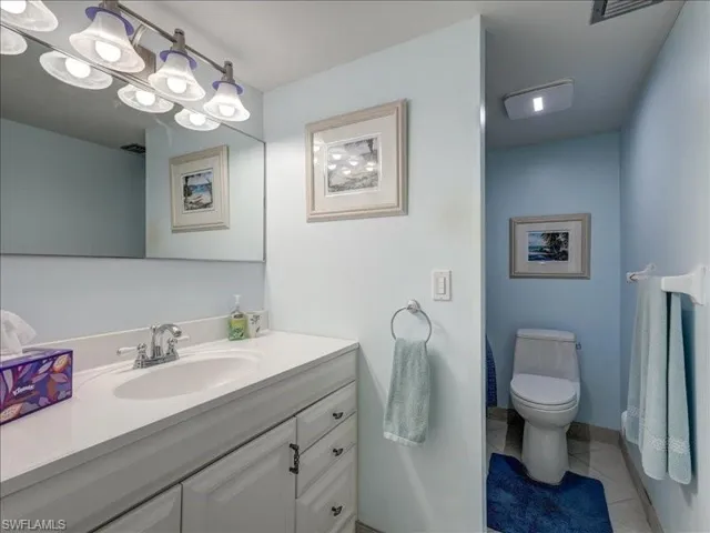 Bathroom featuring vanity and light tile patterned flooring