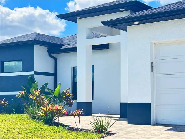 Doorway to property with stucco siding