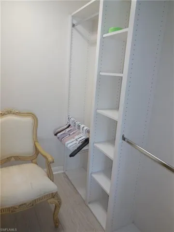 Walk in closet featuring hardwood / wood-style floors