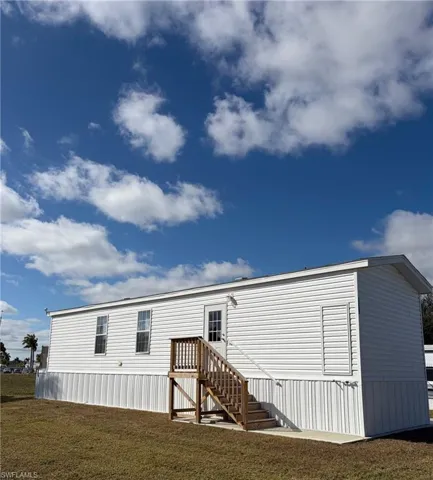 View of front of house with a front yard