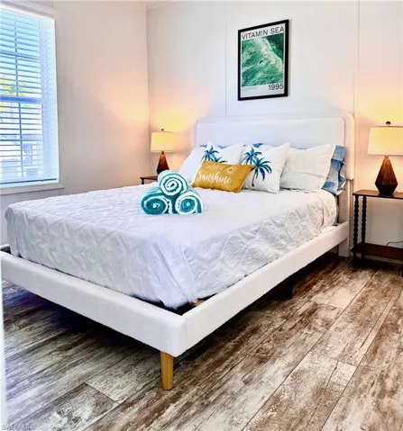 Bedroom with wood-type flooring