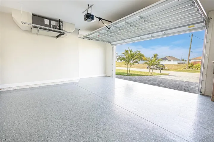 Garage featuring a garage door opener