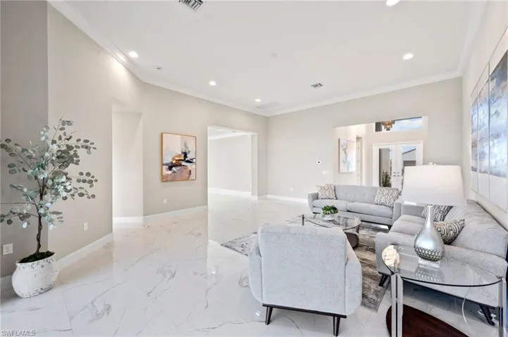 Living room featuring crown molding