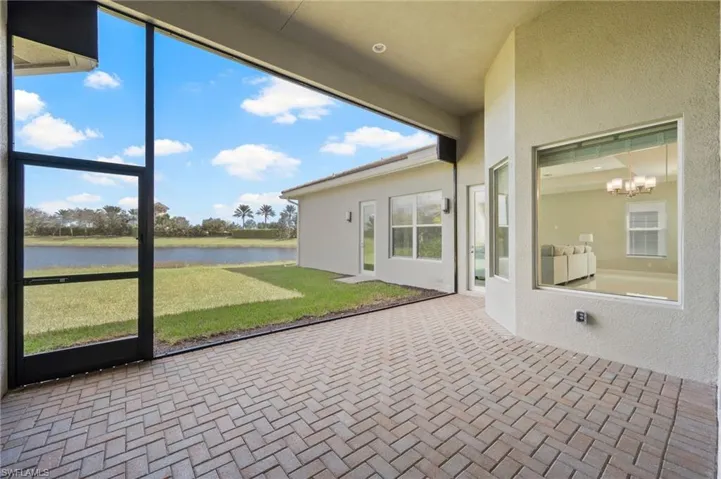 Screened lanai with lots of green space and private eastern lake view - perfect for enjoying morning coffee