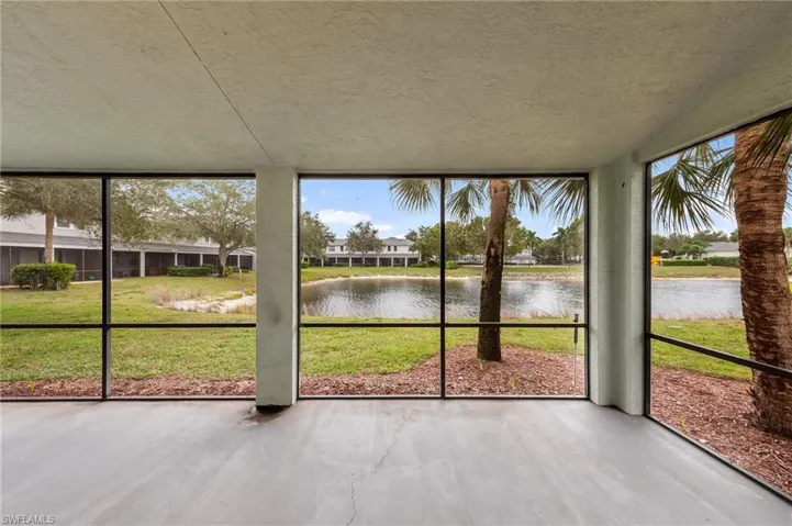 Unfurnished sunroom with a water view and healthy amount of natural light